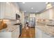 Well-equipped kitchen with granite counters, stainless appliances, and white cabinetry at 4229 Cats Paw Ct, Wake Forest, NC 27587