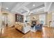 Cozy living room featuring a fireplace, hardwood floors, and large windows at 4229 Cats Paw Ct, Wake Forest, NC 27587