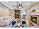 Comfortable living room with hardwood floors, fireplace, and beamed tray ceiling at 4229 Cats Paw Ct, Wake Forest, NC 27587