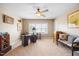 A bright office space features neutral walls, a ceiling fan and natural light at 4229 Cats Paw Ct, Wake Forest, NC 27587