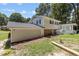 Exterior side view of a house featuring a garage and a charming porch at 4404 Susan Dr, Raleigh, NC 27603