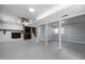 Basement area with painted floors, exposed support columns and stairs at 4404 Susan Dr, Raleigh, NC 27603