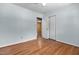 Bedroom with hardwood floors, closet and a door leading to other room at 4404 Susan Dr, Raleigh, NC 27603