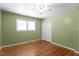 Cozy bedroom featuring hardwood floors, neutral paint, and double door closet at 4404 Susan Dr, Raleigh, NC 27603