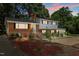 Charming two-story home with a brick facade, white trim, and landscaped yard at 4404 Susan Dr, Raleigh, NC 27603