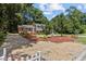 Charming two-story home featuring a brick facade, manicured landscaping, and a spacious gravel driveway at 4404 Susan Dr, Raleigh, NC 27603