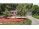 Attractive home with a lush lawn, a garage, and lots of beautiful, mature trees at 4404 Susan Dr, Raleigh, NC 27603