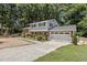 Two-story house featuring brick accents, a garage, and a nicely graveled front yard at 4404 Susan Dr, Raleigh, NC 27603
