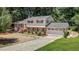 Charming two-story home featuring a well-manicured lawn, a garage, and mature trees at 4404 Susan Dr, Raleigh, NC 27603