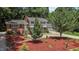 Beautiful two-story house with a well-maintained lawn, a garage, and lush greenery at 4404 Susan Dr, Raleigh, NC 27603