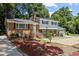 Inviting two-story home with brick accents, a charming front yard, and an attached garage at 4404 Susan Dr, Raleigh, NC 27603