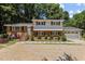 Attractive two-story brick home with a well-manicured lawn, stone walkway, and an attached two-car garage at 4404 Susan Dr, Raleigh, NC 27603