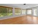 Bright living room with large windows featuring hardwood floors and neutral paint at 4404 Susan Dr, Raleigh, NC 27603