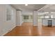 Open living space with large windows and hardwood flooring, offering natural light and a modern feel at 4404 Susan Dr, Raleigh, NC 27603