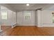 Bright living room with hardwood floors, neutral paint, and an open layout at 4404 Susan Dr, Raleigh, NC 27603