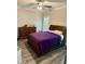 Warm and inviting bedroom featuring hardwood furniture, ceiling fan, modern flooring, and window with blinds at 451 N Lincoln St, Benson, NC 27504