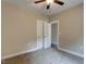 Bedroom featuring neutral walls, carpet, ceiling fan and a closet at 451 N Lincoln St, Benson, NC 27504