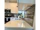 The kitchen includes quartz countertops, modern appliances, gray backsplash, and neutral cabinets at 451 N Lincoln St, Benson, NC 27504