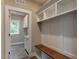Convenient mudroom with custom built-ins including bench seating and ample storage, connecting to laundry room at 451 N Lincoln St, Benson, NC 27504