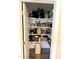 Walk-in pantry has white shelving and durable floors, perfect for storage and organization at 451 N Lincoln St, Benson, NC 27504