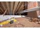 View of the attic space with insulation and visible wooden rafters at 503 Tarleton Ave, Burlington, NC 27215