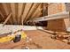 View of the attic space with insulation and visible wooden rafters at 503 Tarleton Ave, Burlington, NC 27215