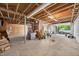 Open basement area with utility features, garage door and backyard access, excellent project space at 503 Tarleton Ave, Burlington, NC 27215