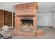 Basement brick fireplace, with adjacent drumset, perfect for entertaining guests at 503 Tarleton Ave, Burlington, NC 27215