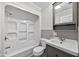 Bright bathroom with tub-shower combo, gray vanity, and a sleek design at 503 Tarleton Ave, Burlington, NC 27215