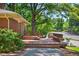 Outdoor deck offering a relaxed space for seating and enjoying the surrounding landscape, complete with a wooden bench at 503 Tarleton Ave, Burlington, NC 27215