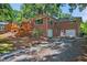 Brick exterior of the house with multi-car garage and wooden deck, great curb appeal at 503 Tarleton Ave, Burlington, NC 27215