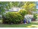 Backyard view with covered deck and mature landscaping at 506 Currin St, Durham, NC 27703