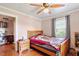 Bright bedroom with hardwood floors, natural light, and cozy furnishings at 506 Currin St, Durham, NC 27703