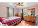 Bedroom with hardwood floors, a ceiling fan, natural light, and classic furnishings at 506 Currin St, Durham, NC 27703