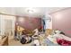Bedroom featuring a bed, clothes rack, decorations on the walls and personal belongings scattered about at 506 Currin St, Durham, NC 27703