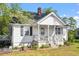 Quaint home with a covered porch perfect for relaxing at 506 Currin St, Durham, NC 27703