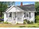 Inviting home boasting a classic front porch and swing at 506 Currin St, Durham, NC 27703