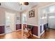 Open hallway with hardwood floors and access to rooms at 506 Currin St, Durham, NC 27703