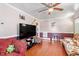 Cozy living room with hardwood floors, white ceiling paneling, and comfortable seating at 506 Currin St, Durham, NC 27703