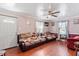 Open living room featuring hardwood floors, comfortable seating, and natural light at 506 Currin St, Durham, NC 27703