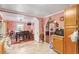 Open floor plan with kitchen, dining room, pink walls, wood floors and views of other rooms of the house at 506 Currin St, Durham, NC 27703