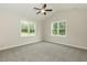 This bedroom features two windows with great natural light and a ceiling fan at 510 Branch St, Rocky Mount, NC 27801