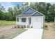 Charming single-story home with a covered porch, attached garage, and a well-manicured front yard at 510 Branch St, Rocky Mount, NC 27801