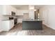 Stylish kitchen with granite countertops, stainless steel appliances, and a gray kitchen island at 510 Branch St, Rocky Mount, NC 27801