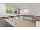 Basement featuring built-in desk area and natural light from multiple windows at 5123 Richland Dr, Raleigh, NC 27612