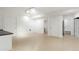 Open basement area offering versatile space, light colored wood-look flooring, and neutral walls at 5123 Richland Dr, Raleigh, NC 27612