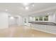 Large basement area with access to outdoor and built-in desk area at 5123 Richland Dr, Raleigh, NC 27612
