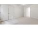Carpeted bedroom with a closet and access to other bedrooms at 5123 Richland Dr, Raleigh, NC 27612