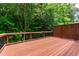 Private deck overlooking a lush wooded area, great for relaxing at 5123 Richland Dr, Raleigh, NC 27612