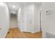 Hallway with stairs and multiple doors to other rooms at 5123 Richland Dr, Raleigh, NC 27612
